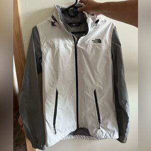 North face rain jacket in white and gray.